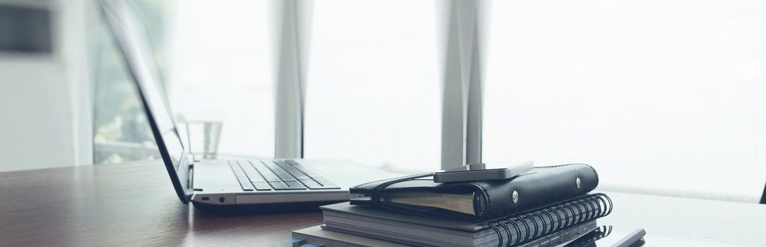 Office workplace with laptop and smart phone on wood table